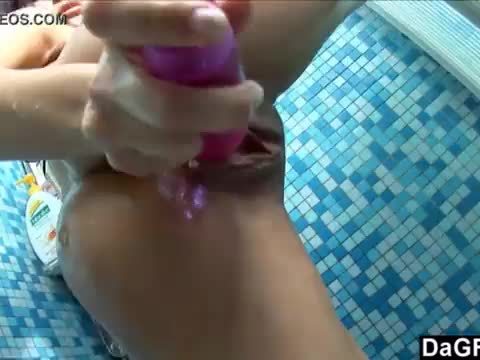 Girl massages her suds covered tits before creaming